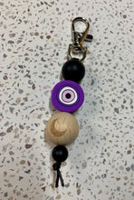 Load image into Gallery viewer, Purple Evil Eye With Crescent Wooden Bead Key Charm.
