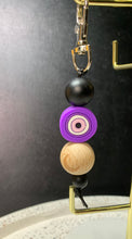 Load image into Gallery viewer, Purple Evil Eye With Crescent Wooden Bead Key Charm.
