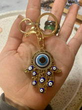 Load image into Gallery viewer, Hamsa Hand With Evil Eyes Key Charm
